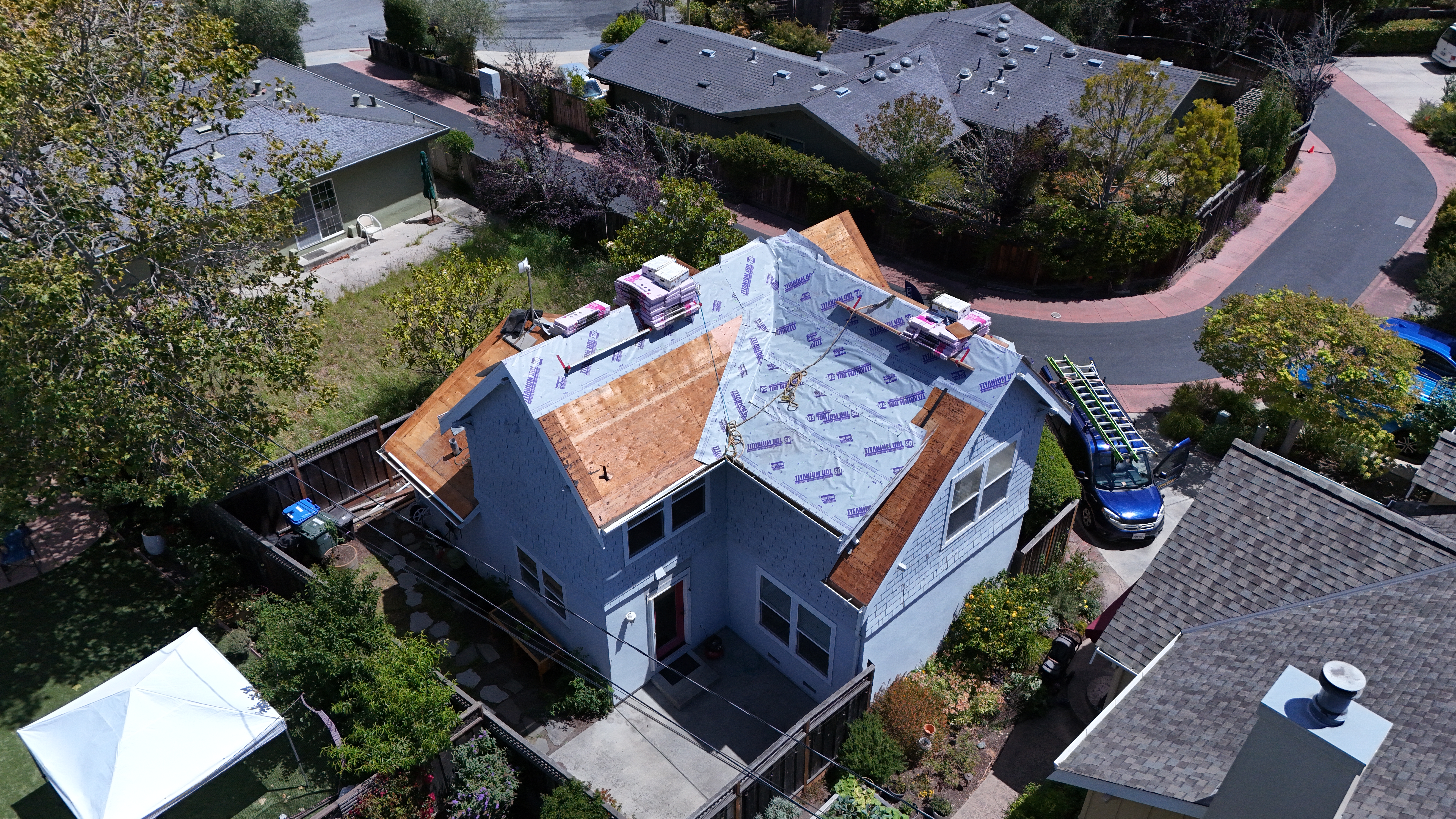 Front elevation showing Titanium underlayment installed and Duration shingle bundles staged